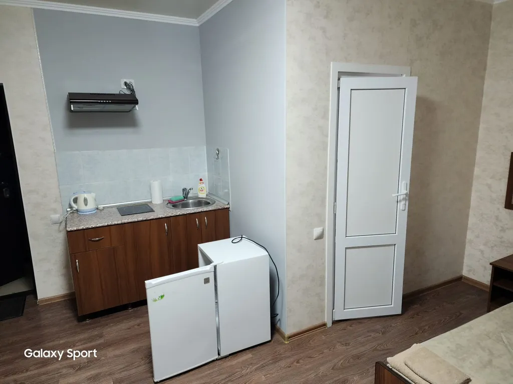 Трехместный номер с балконом и кухней