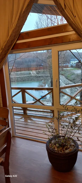 Шале в горах на берегу реки