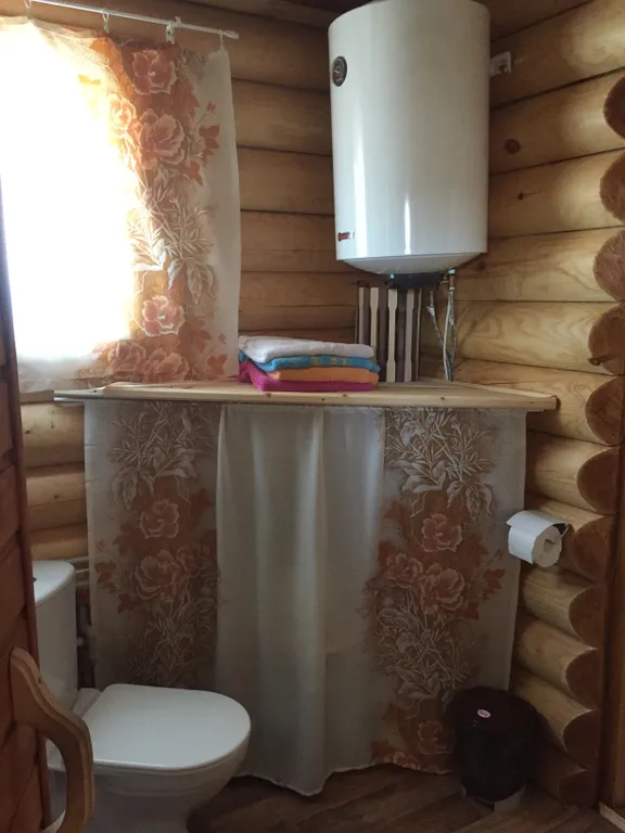 Дом из бревна Терем с сауной в черте города