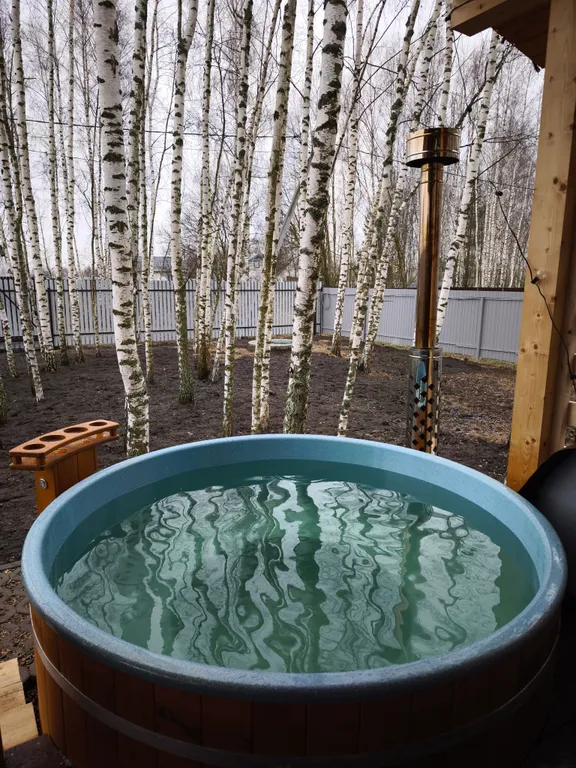 Дом шале с горячей купелью на террасе