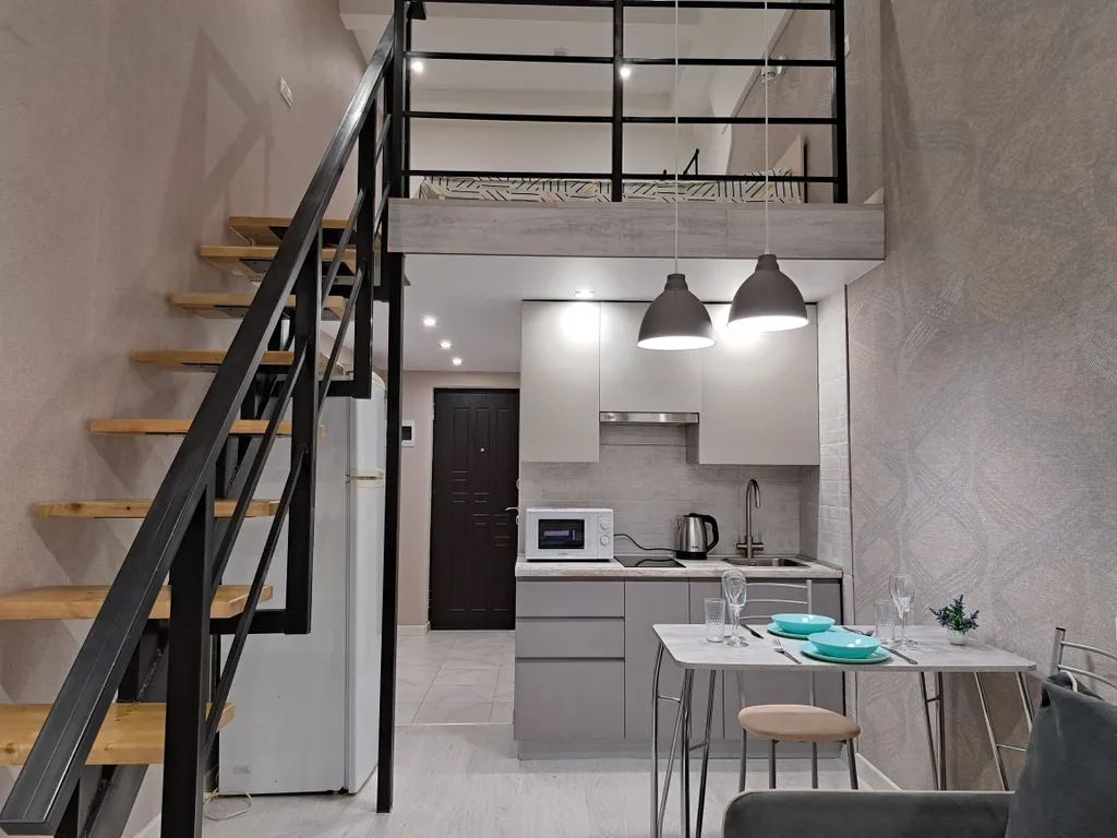 Стильная и уютная двухъярусная студия