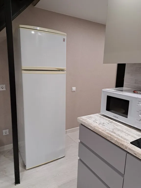 Стильная и уютная двухъярусная студия