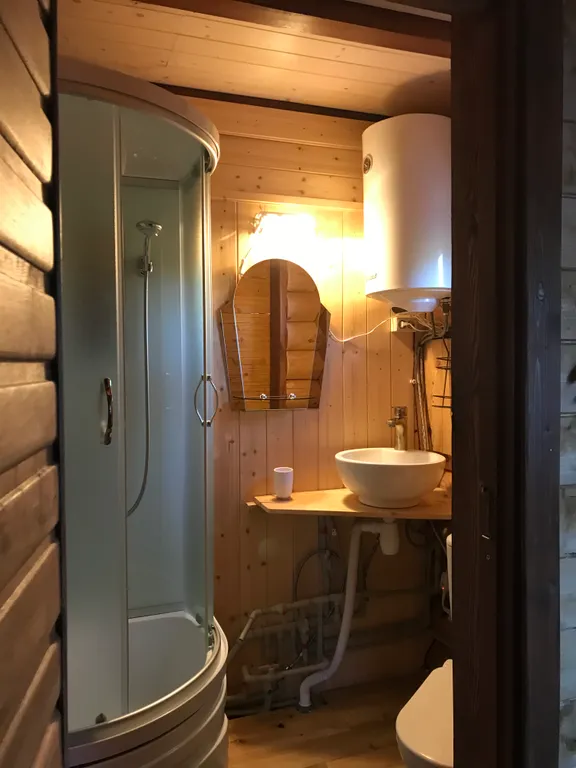 Дом из бревна Терем с сауной в черте города