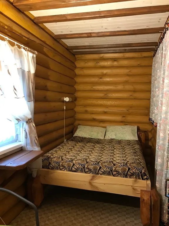 Дом из бревна Терем с сауной в черте города