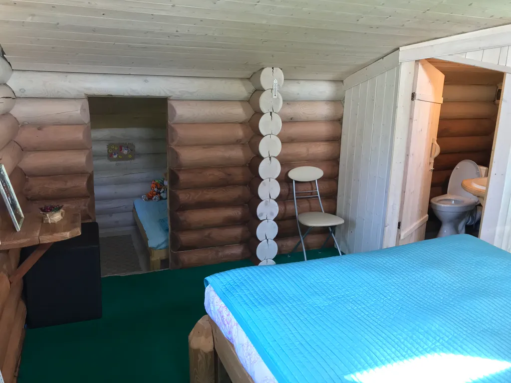 Дом из бревна Терем с сауной в черте города