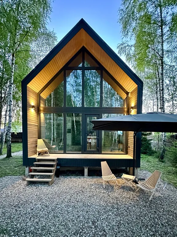 Новый панорамный барнхаус с сауной на лесном участке