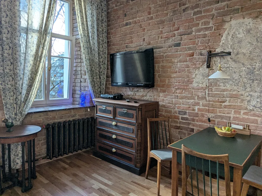 Уютная двухуровневая квартира-студия в доме XIX века