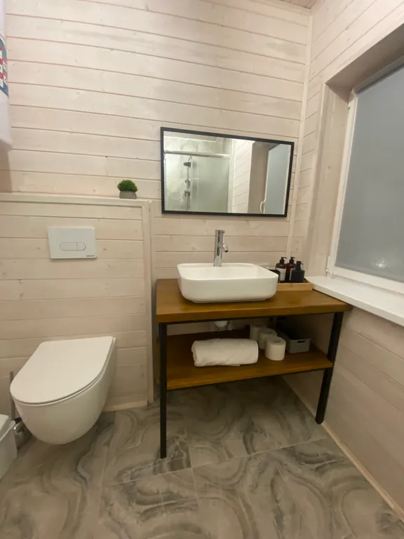 Дом с купелью на берегу реки