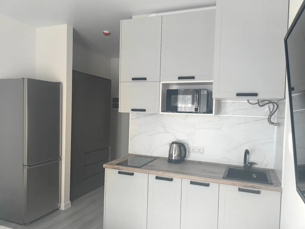 Уютная студия с видом на бассейны