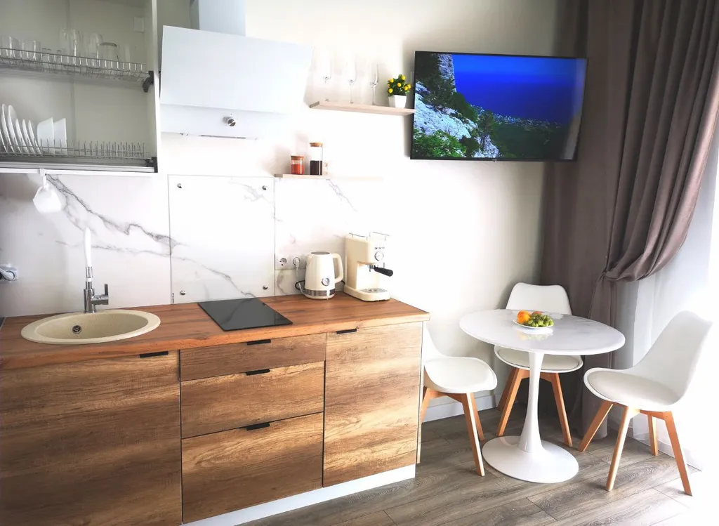 Студия комфорт с видом на горы и бассейнами во дворе