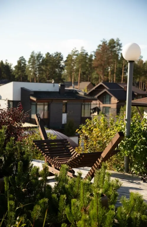 Дизайнерский коттедж с садом на крыше