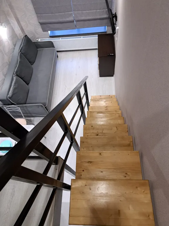 Стильная и уютная двухъярусная студия