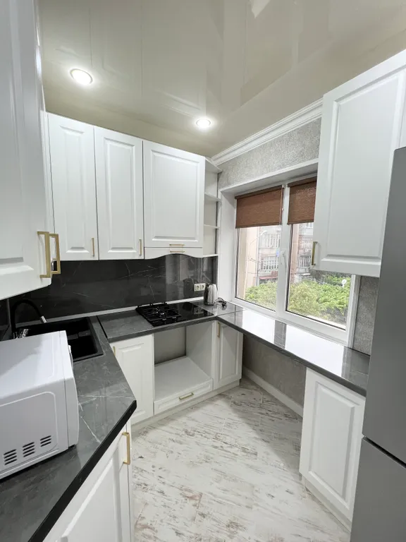 Апартамент с видом на море и на колесо обозрения