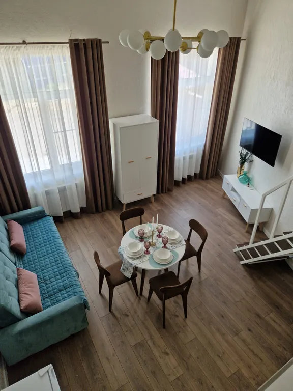 Уютная двухуровневая студия в центре