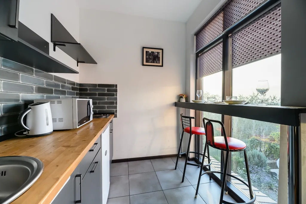 Апартаменты с террасой с видом на город и горы