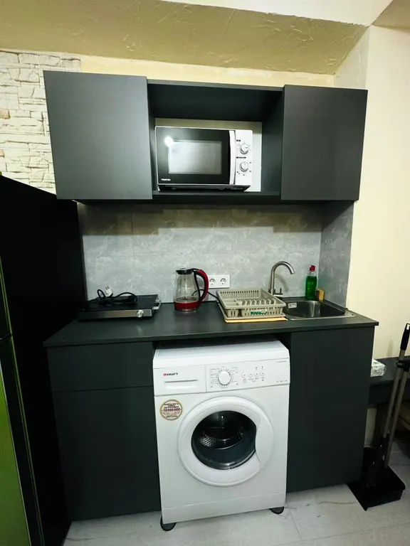 В центре рядом с музеем Сергея Параджанова