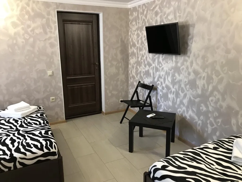 Четырёхместный люкс c двумя двуспальными кроватями