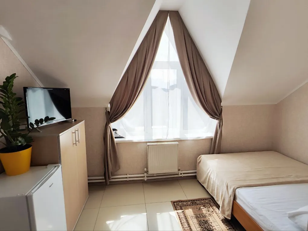 Семейный номер на мансарде в гостевом доме Регион 86