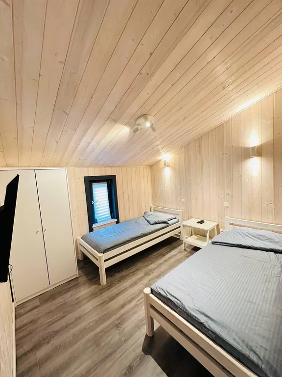 Уютный дом в скандинавском стиле среди сосен с сауной