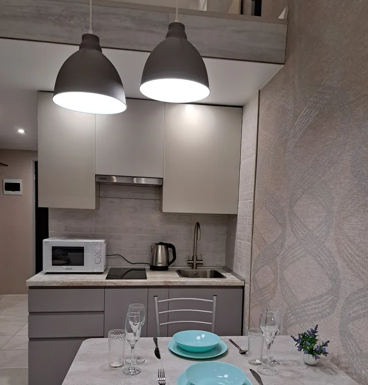 Стильная и уютная двухъярусная студия