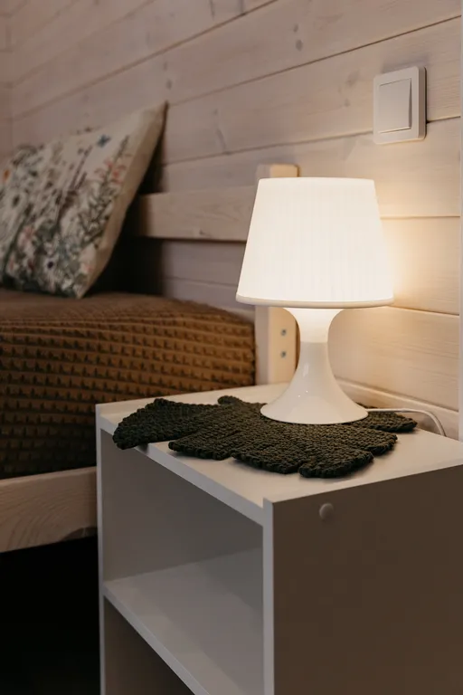 Дом с панорамными окнами и террасой в окружении леса