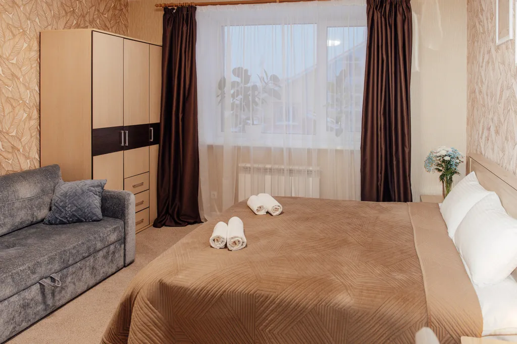 Семейный номер с двуспальной кроватью и раскладным диваном