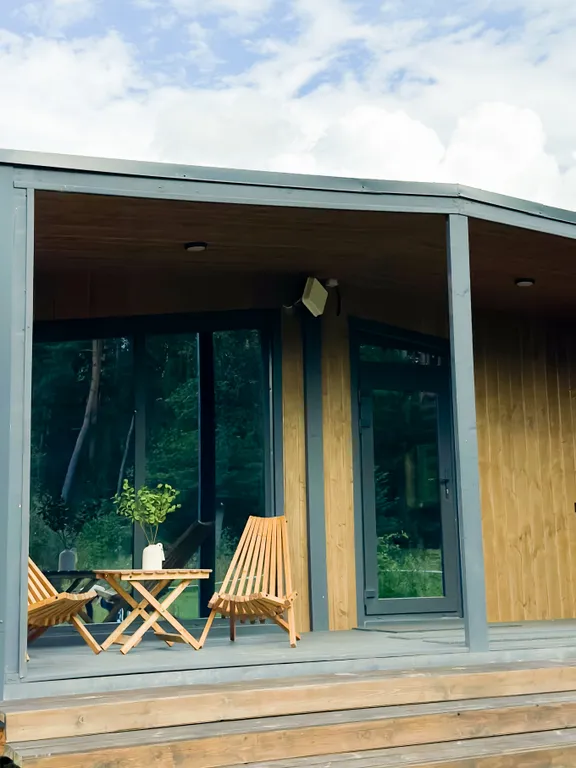 Дом в лесу с сауной в стиле барнхаус