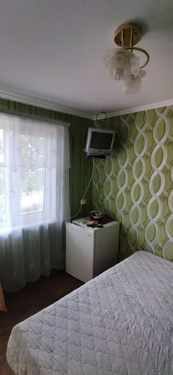 Двухместный номер на берегу моря с двумя односпальными кроватями.