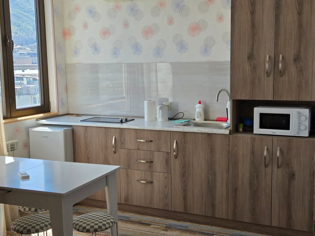 Апартамент с балконом с видом на город