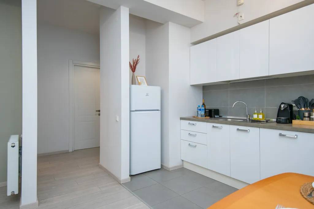 Уютные апартаменты с видом на колесо обозрения и город