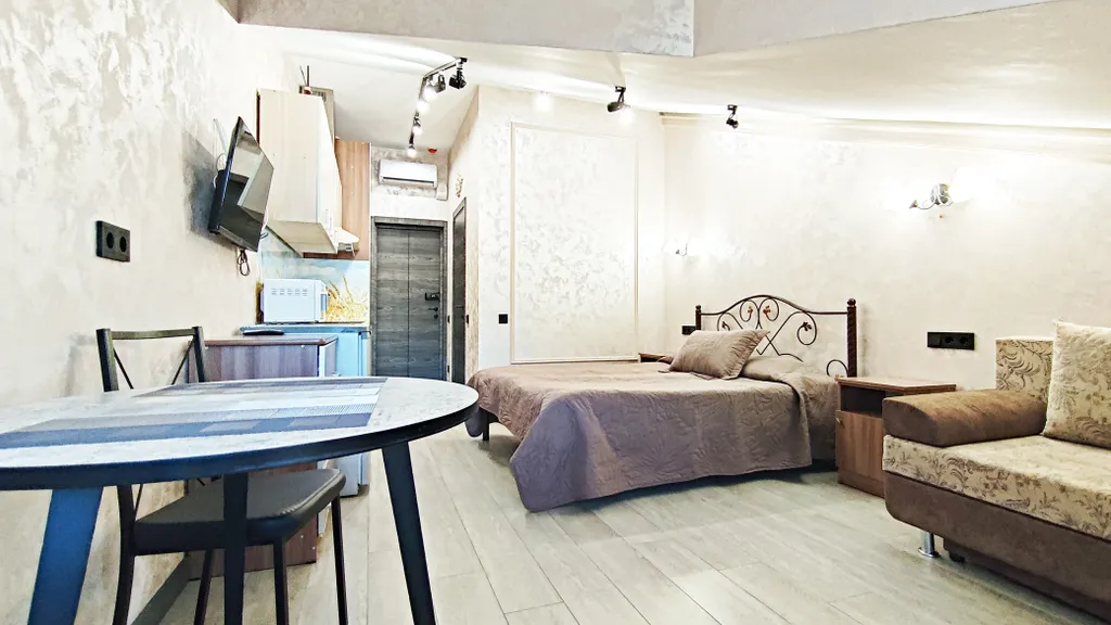 Уютная студия с балконом и красивым видом на горы