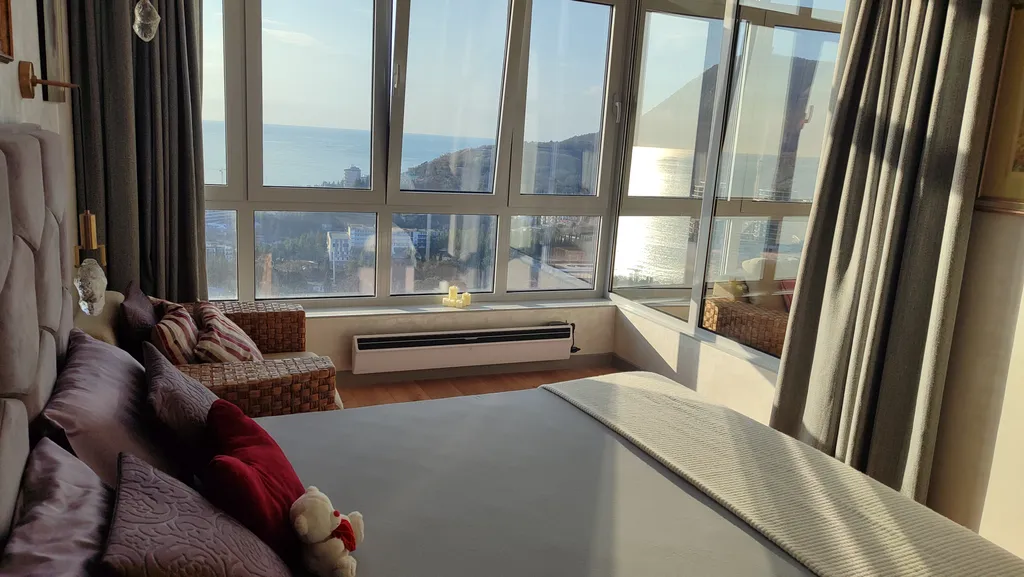 Апартамент Любимое Небо - море и горы - наслаждаться лежа на кровати