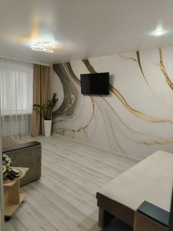 Квартира в центре на первом этаже с асфальтированной парковкой