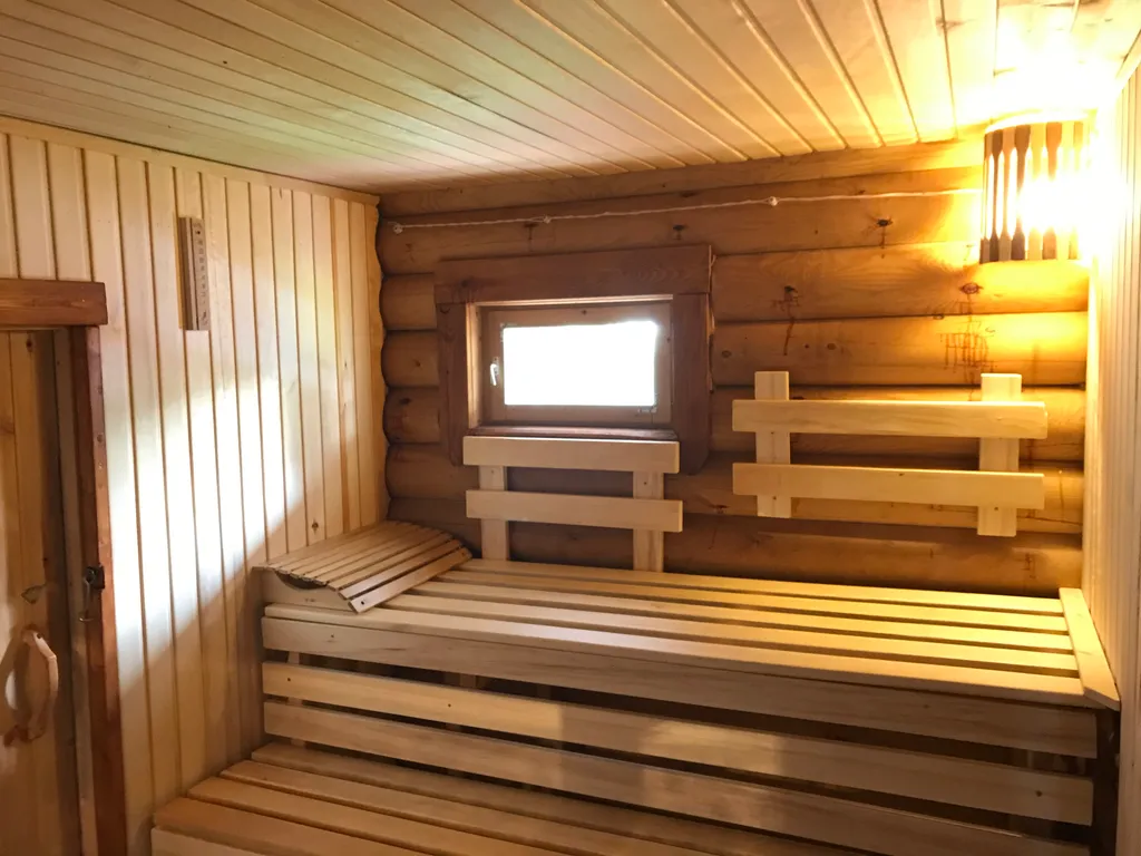 Дом из бревна Терем с сауной в черте города