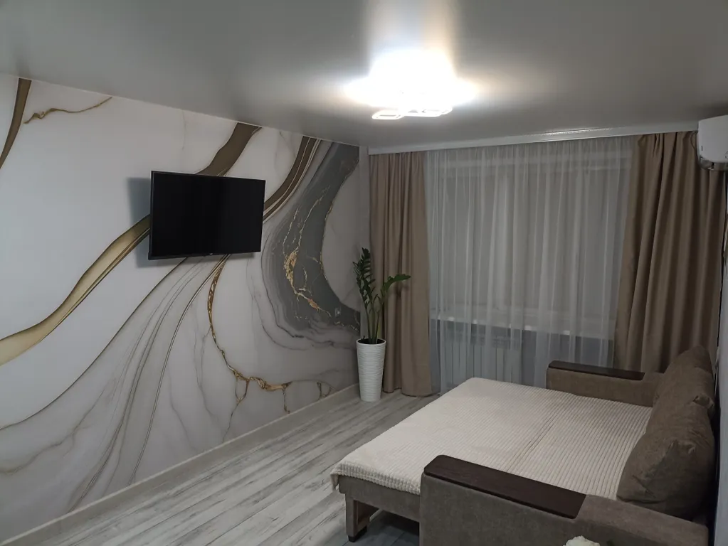 Квартира в центре на первом этаже с асфальтированной парковкой