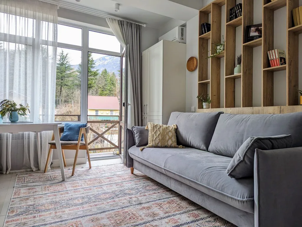 Двухуровневая квартира с балконом в центре