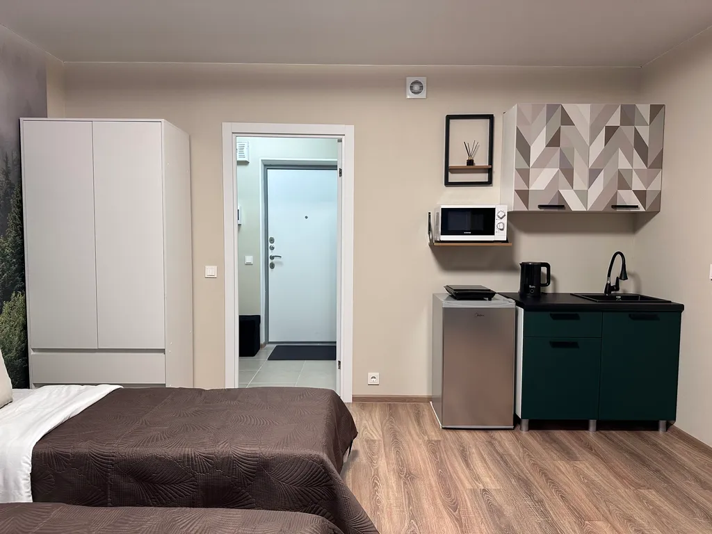 Студия с тремя раздельными кроватями