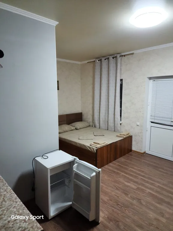 Трехместный номер с балконом и кухней