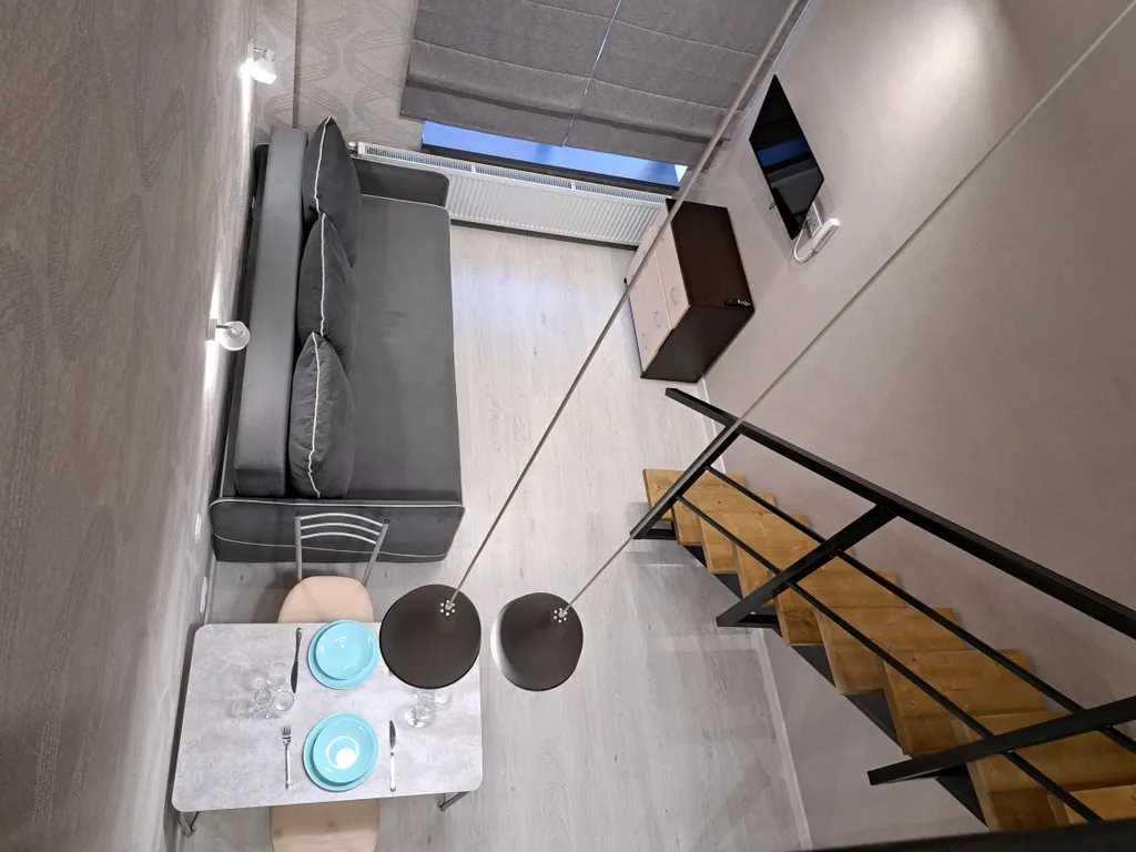 Стильная и уютная двухъярусная студия