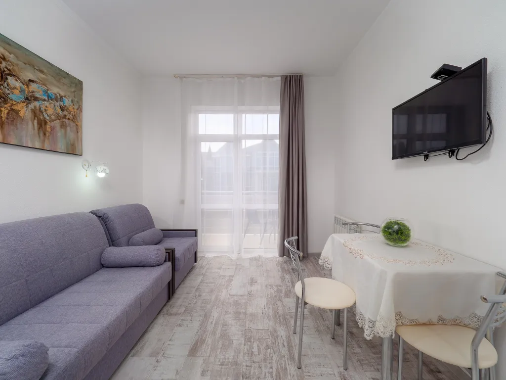 Квартира Квартира Уютная студия у моря с теплым бассейном — Сириус