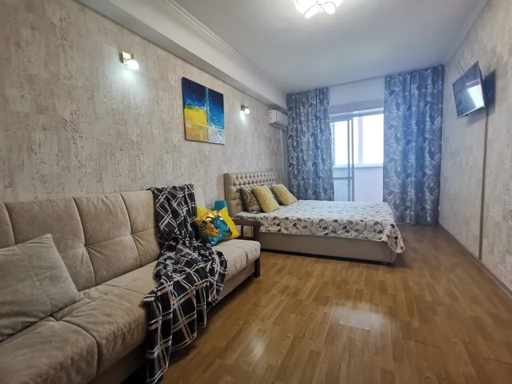 Солнечная квартира с видом на город