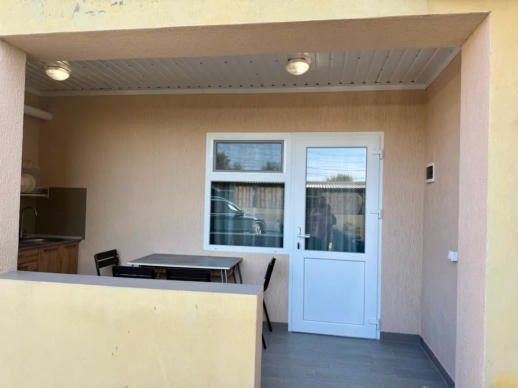 Семейный номер с кухней на веранде в центре