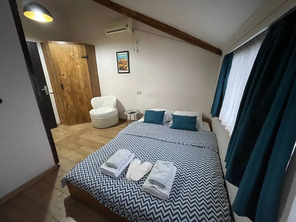 Уютная студия в мансарде грузинского дворика