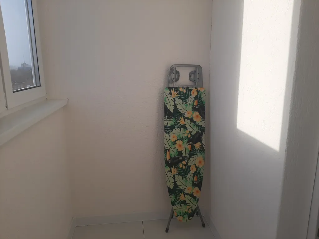 Уютная студия с видом на колесо обозрения