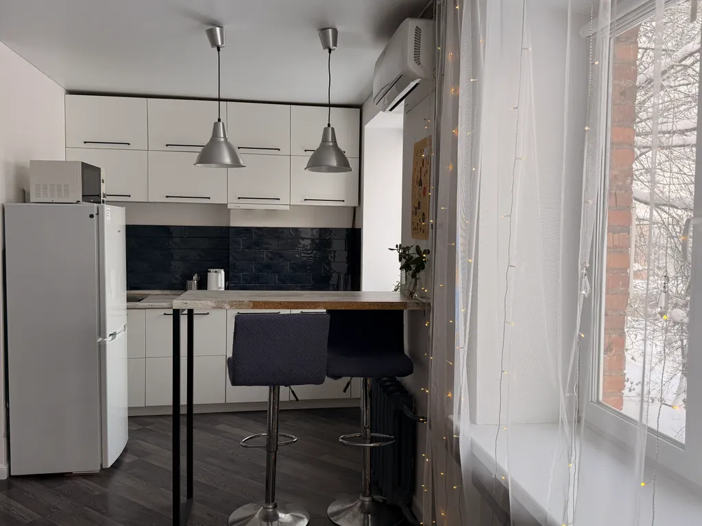 Уютная квартира-студия с отдельной спальней в самом центре города