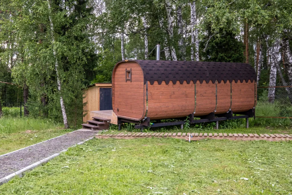 Современный дом с баней в лесу