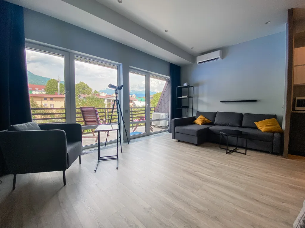 Апартаменты с террасой с панорамным видом на горы