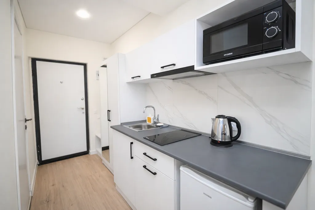 Студия с панорамным видом на город, горы и стадион