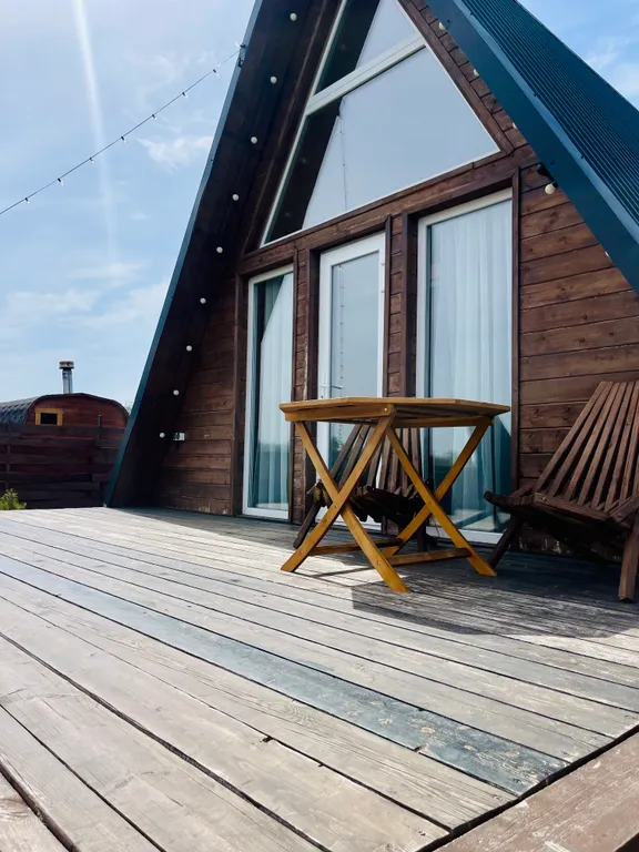 Треугольный дом