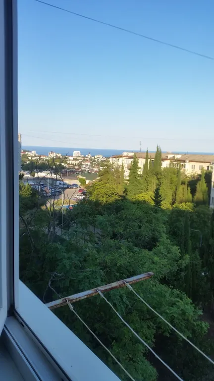 Квартира с видом на море, город и горы